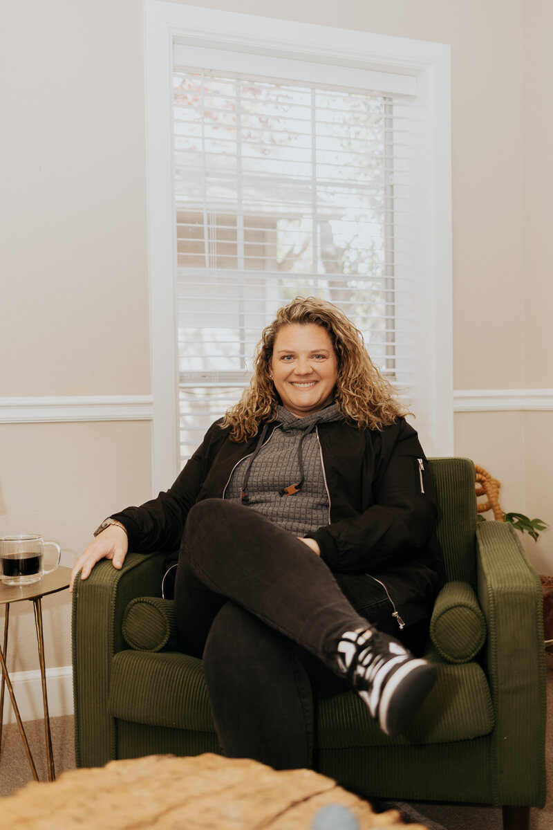 Ali Tipton, LCSW, relaxed in her therapy office armchair in Tulsa, Oklahoma