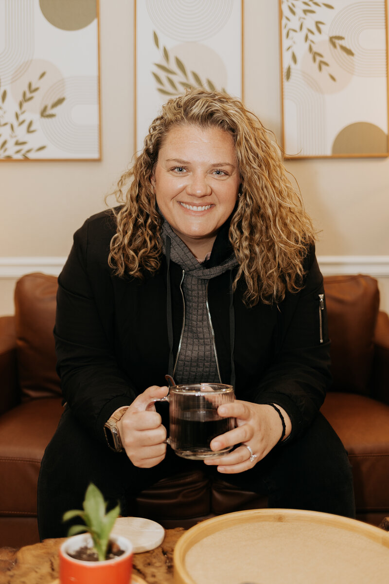 Ali Tipton, LCSW, smiling in her Tulsa therapy office